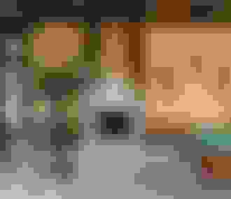 Living room in the Zola house with billiards table%252C fireplace%252C and antique tools on the wall